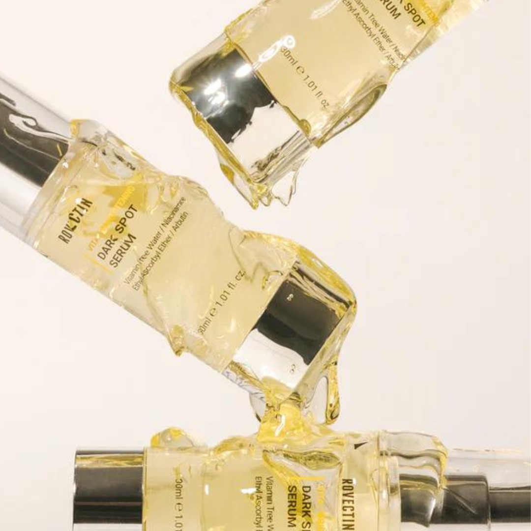 Rovectin Vita Dark Spot Serum 30ml in a clear glass bottle with a pump, featuring a sleek design and white label.