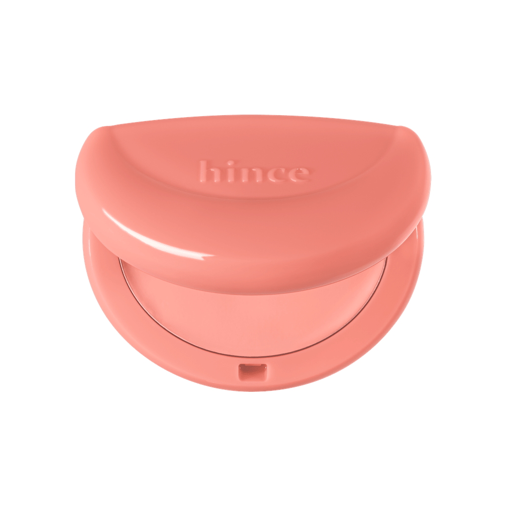 Hince Half-Moon Cheek Cream to Powder Blush in a compact, showing soft pink formula and applicator brush.