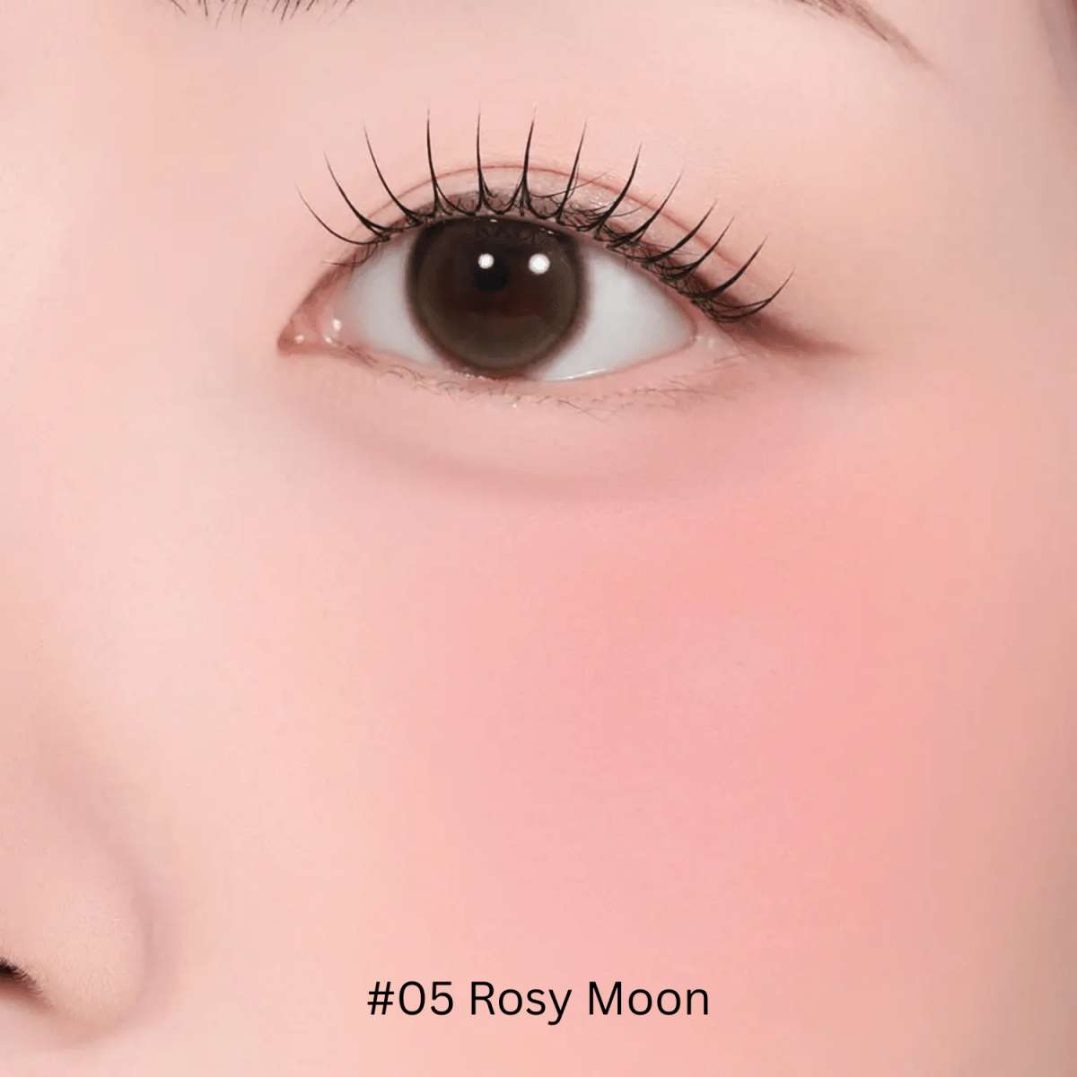 Hince Half-Moon Cheek Cream to Powder Blush in a compact with a curved, half-moon shape and soft pink color.
