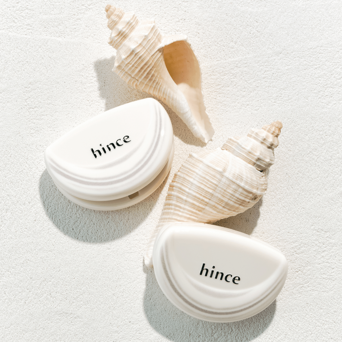 Hince Half-Moon Cheek Cream to Powder blush in Chill Voyage Edition, showing a close-up of the pink-toned blush compact.