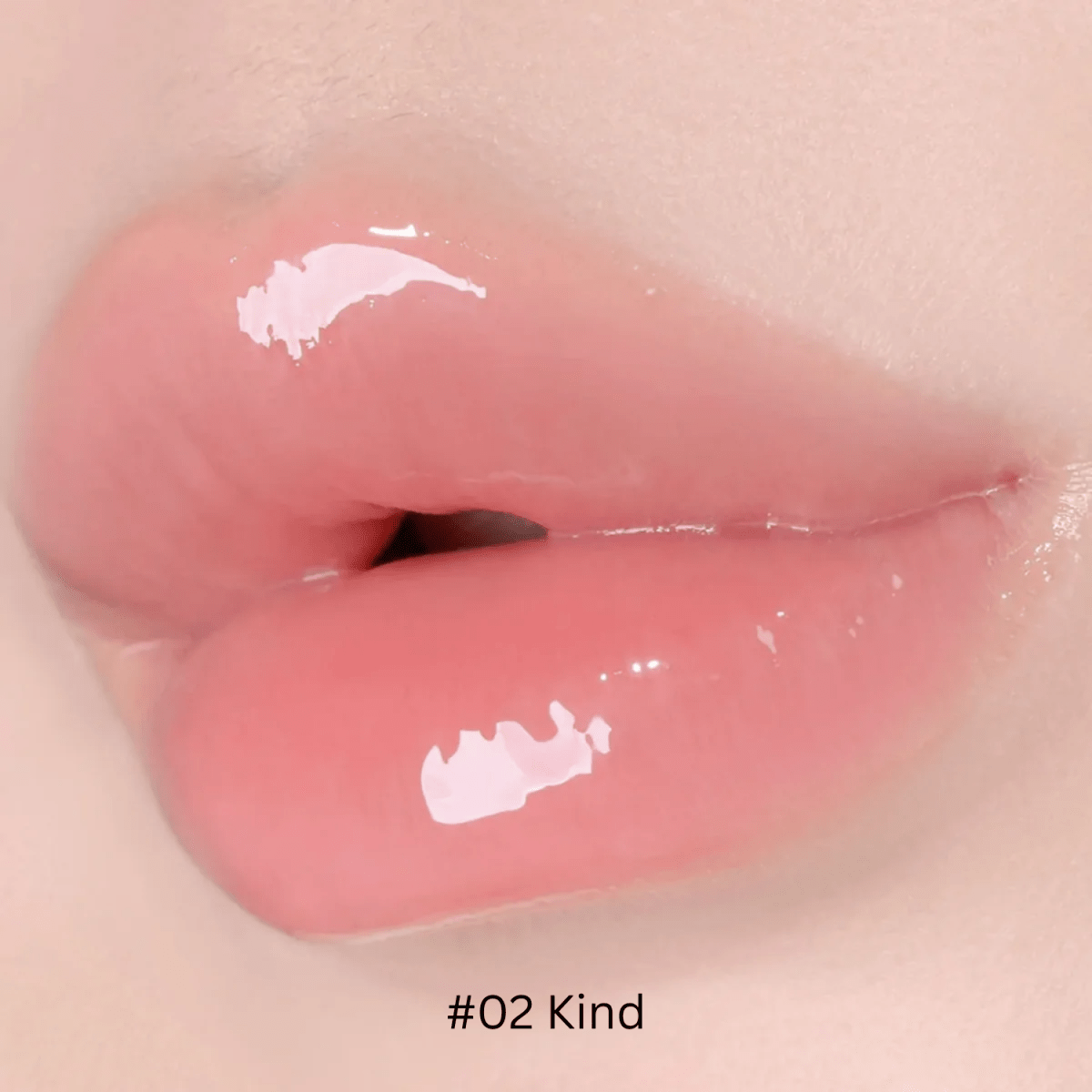 Hince Mirror Dew Gloss lip gloss tube with shiny packaging, showcasing the glossy, reflective finish of the product.