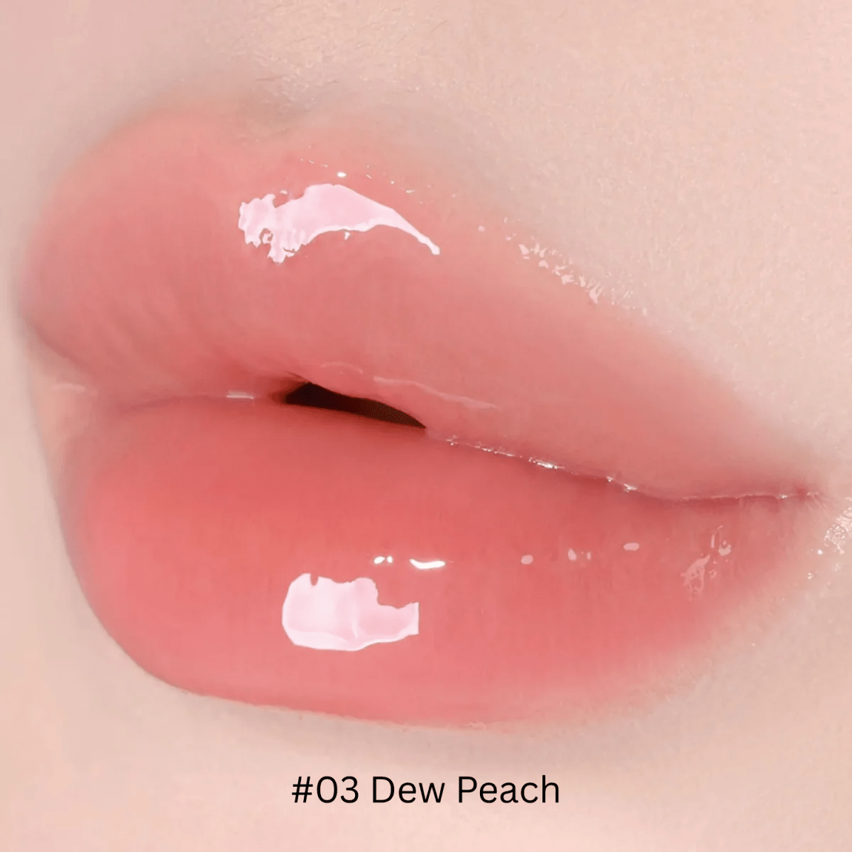 Hince Mirror Dew Gloss lip gloss tube with shiny, reflective packaging, showcasing a glossy finish for smooth, hydrated lips.