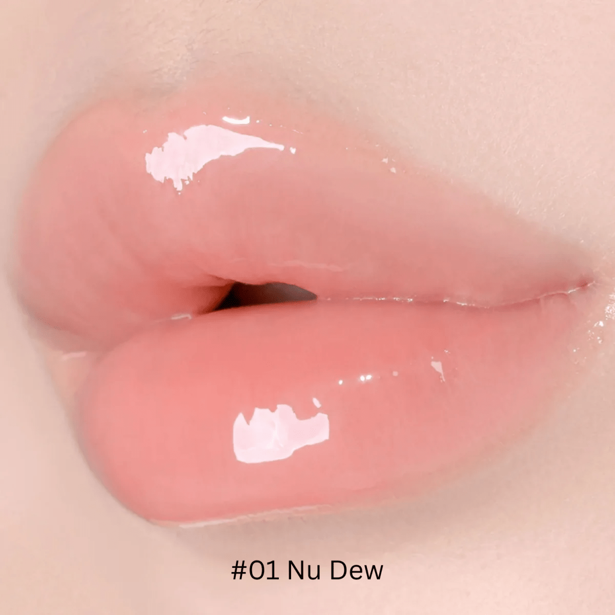 Hince Mirror Dew Gloss lip gloss in a clear container, showcasing its shiny, glossy finish and reflective mirror-like packaging.