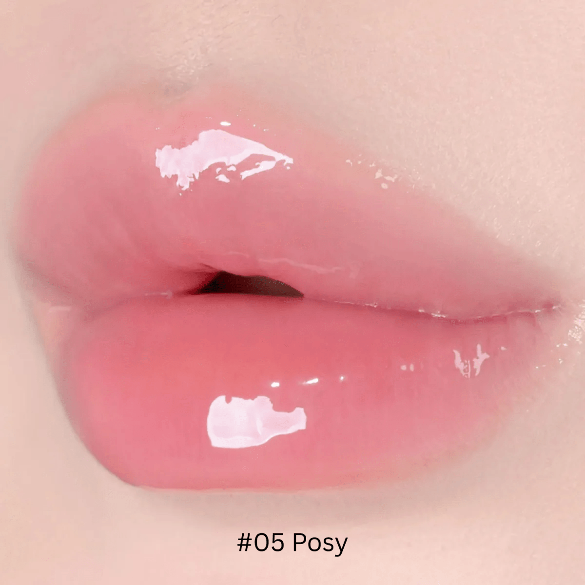 Hince Mirror Dew Gloss lip gloss applied on lips, shiny and glossy finish, close-up shot showing smooth texture and reflective shine.