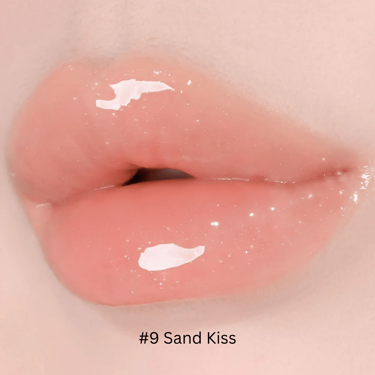 Hince Mirror Dew Gloss lip gloss in a clear, shiny tube showing the glossy, reflective finish of the product inside