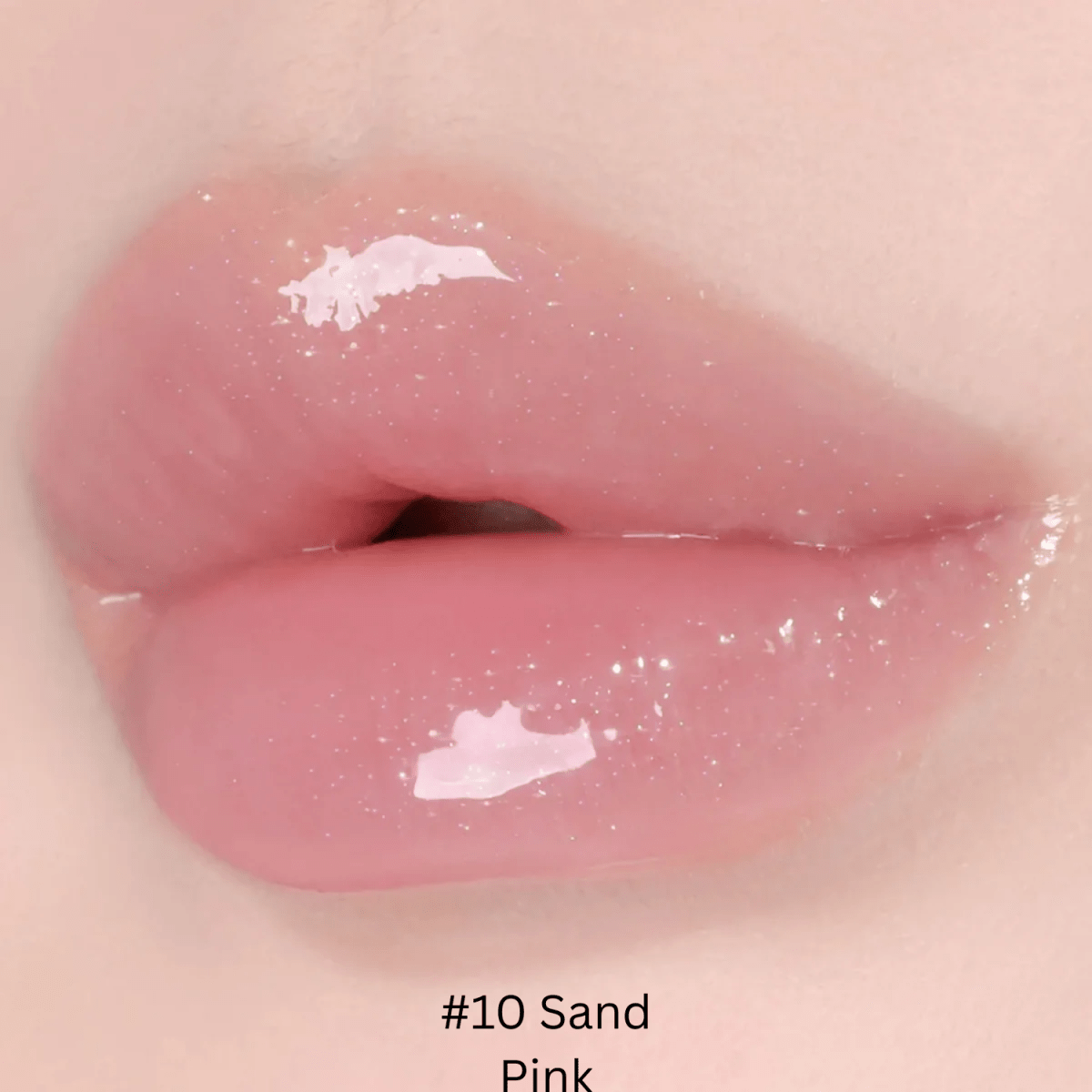 Hince Mirror Dew Gloss lip gloss with a glossy finish, showcased in a sleek tube with a reflective cap.