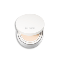 Hince Nu Glow White Cushion foundation with a sleek compact, featuring a smooth, luminous finish for even skin tone.